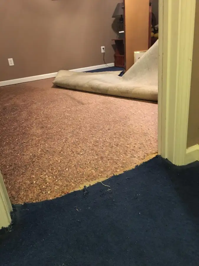 Carpet pad removal revealing water damage during Drying & Dehumidification in Crestview
